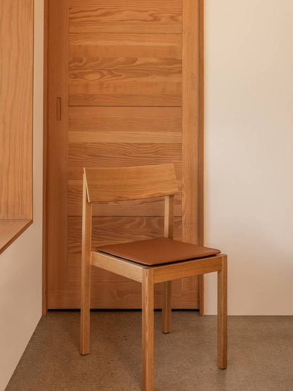 Audo Mauro Dining Chair sfeerbeeld met zitkussen