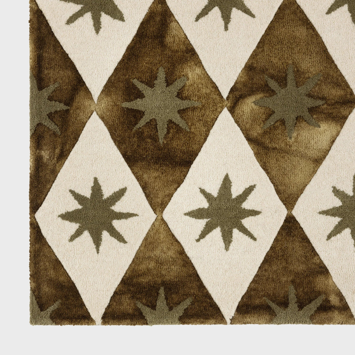 Dusty Deco Cosmico Rug Green detailfoto wol en geometrisch patroon